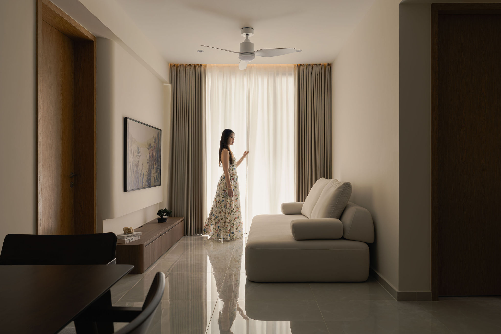 Japandi living room with floor-to-ceiling sheer curtains