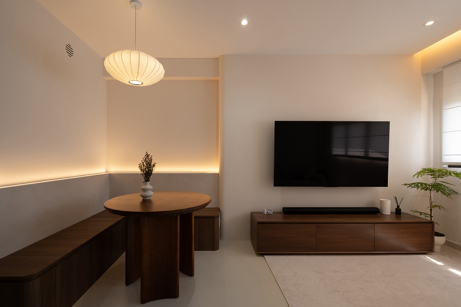 Wabi-sabi HDB living room with paper-lantern pendant