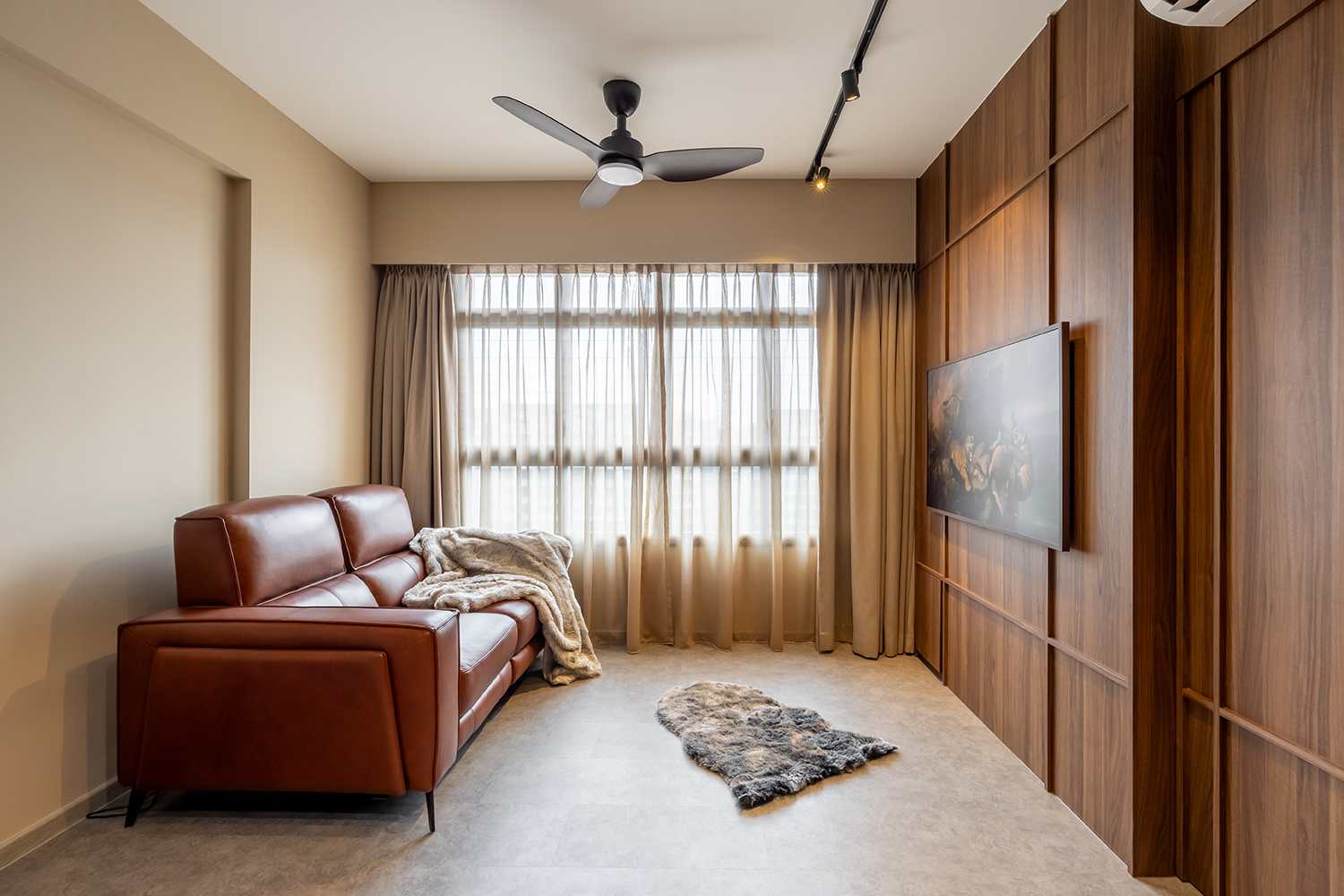 Wabi-sabi HDB living room with leather sofa and timber feature wall
